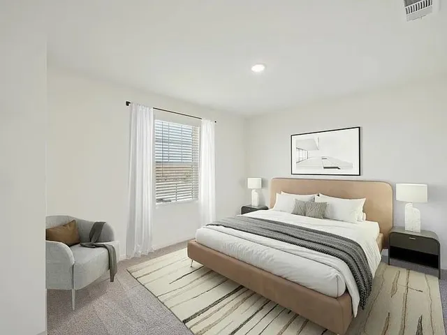 a bedroom with a bed and a couch