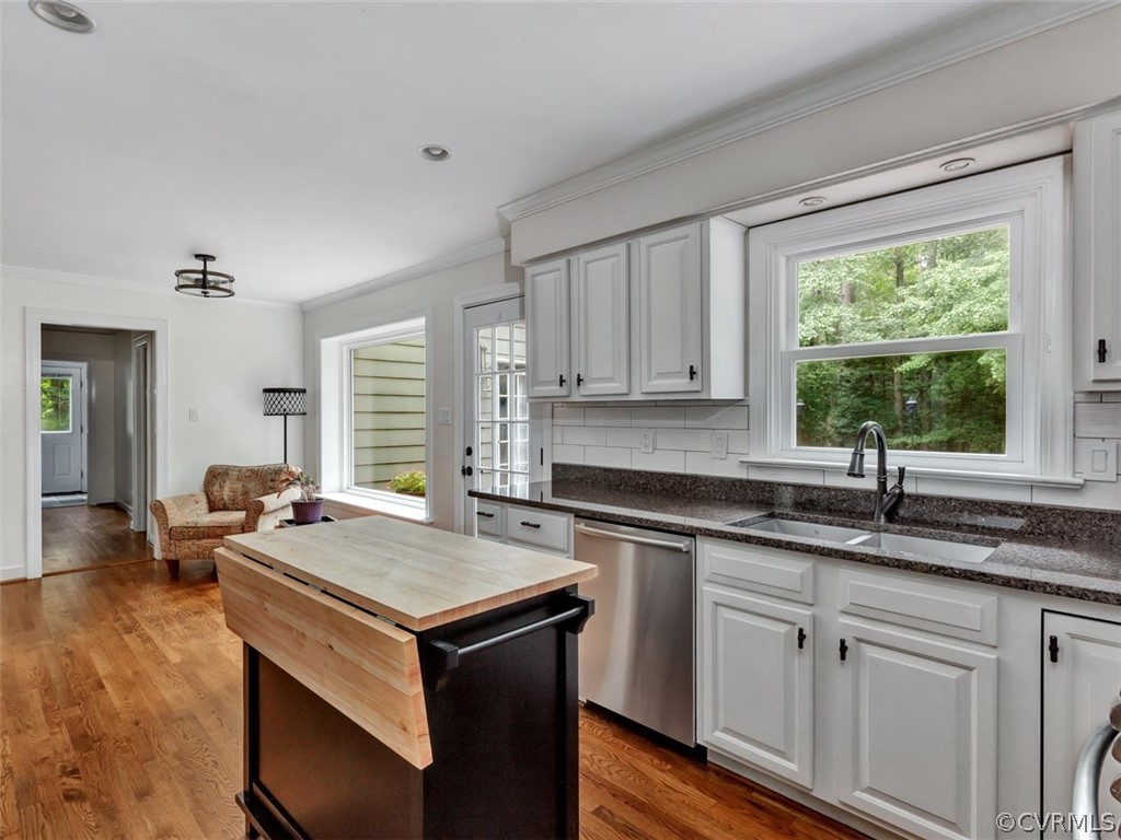 14042 Princess Mary Road Chesterfield, VA 23838 - Photo 6 of 31 a kitchen with a stove sink and cabinets