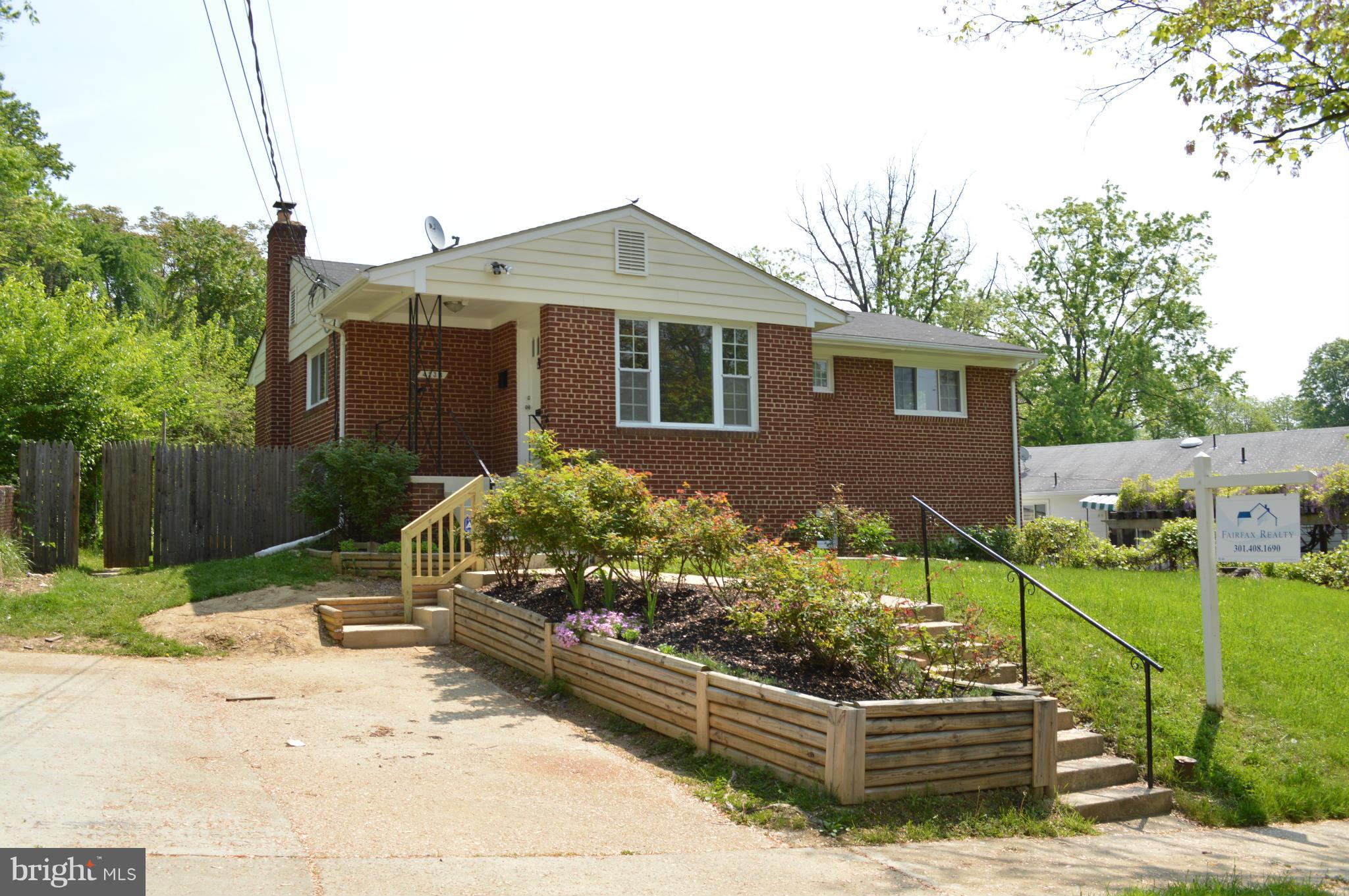 4238 Isbell Street Silver Spring, MD 20906 - Photo 1 of 22 a front view of a house with a yard