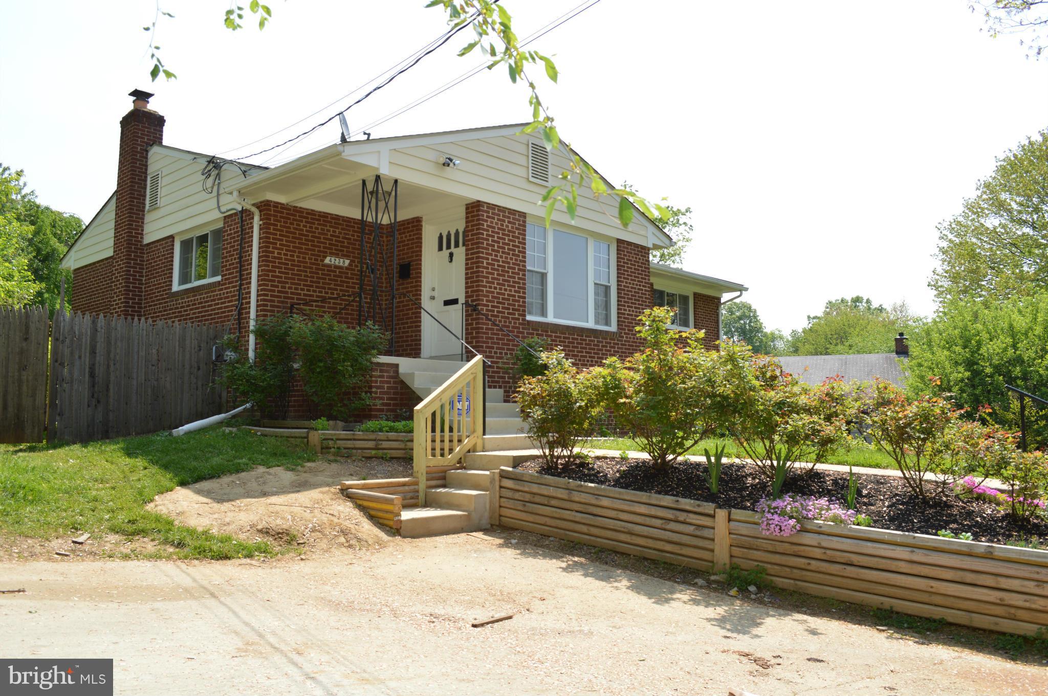 4238 Isbell Street Silver Spring, MD 20906 - Photo 2 of 22 a view of a house with a yard and a garden
