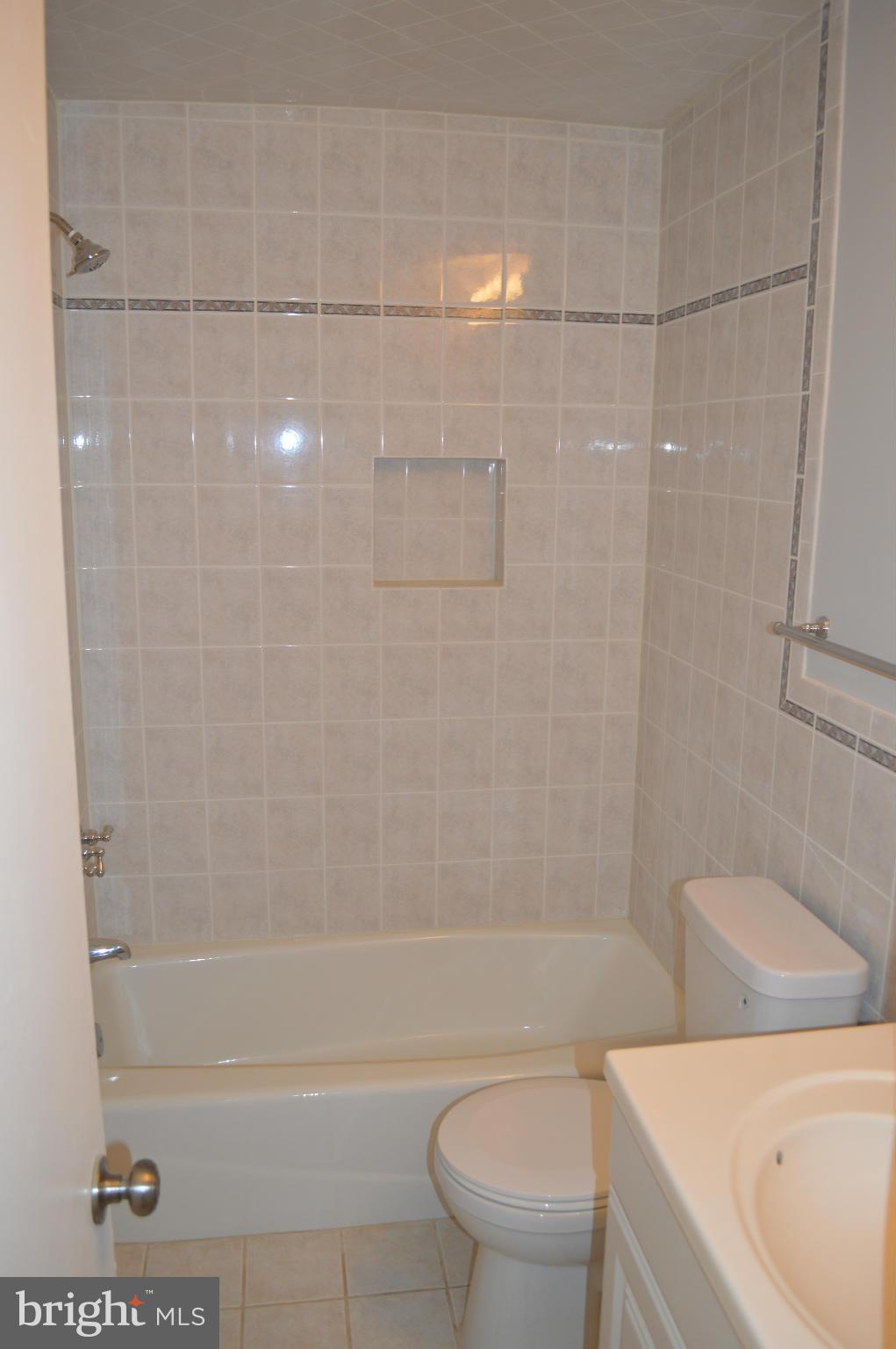 4238 Isbell Street Silver Spring, MD 20906 - Photo 12 of 22 a bathroom with a toilet and a shower