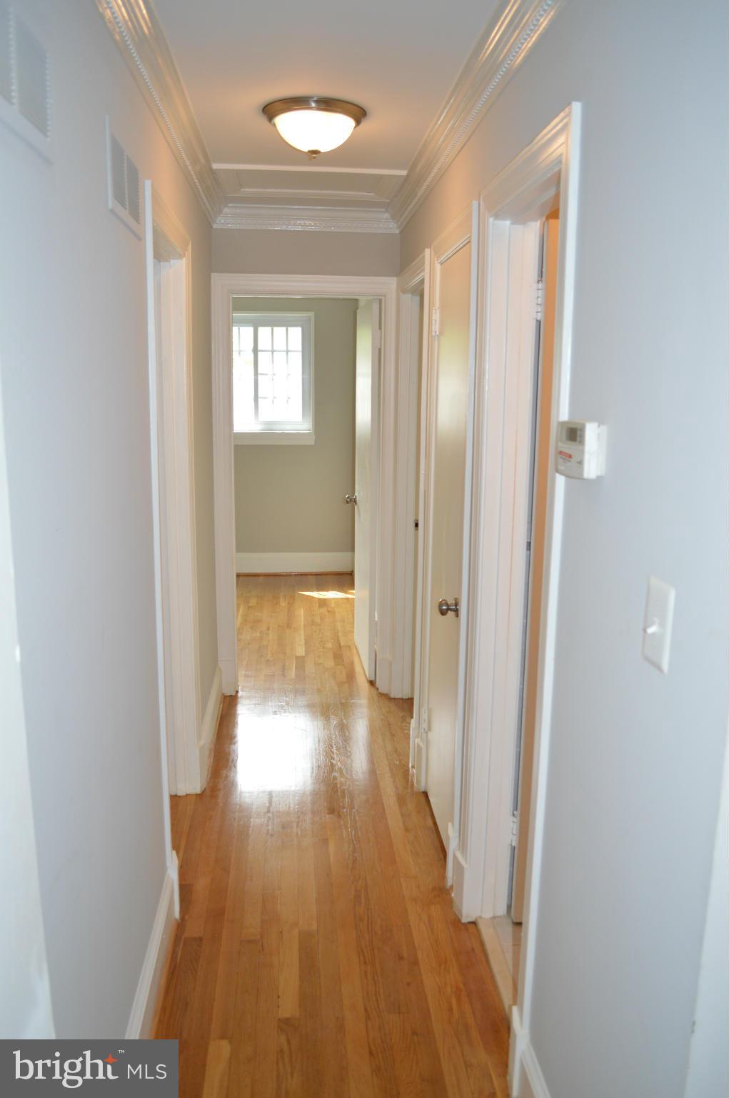 4238 Isbell Street Silver Spring, MD 20906 - Photo 9 of 22 a view of hallway with wooden floor