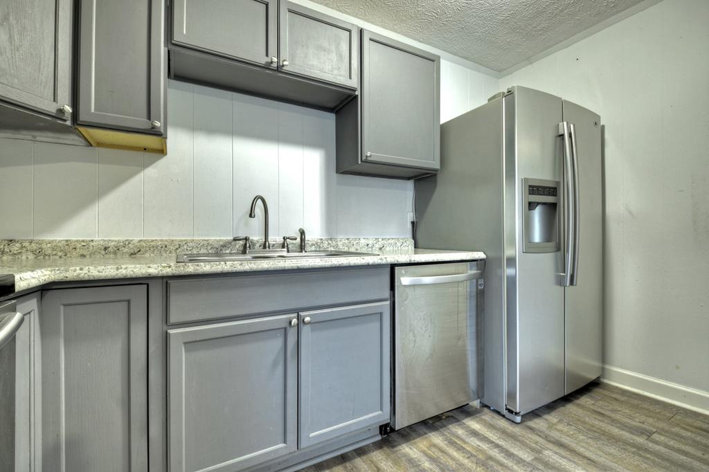 870-868 Sugar Creek Road Blue Ridge, GA 30513 - Photo 13 of 84 a kitchen with stainless steel appliances granite countertop a refrigerator and a sink