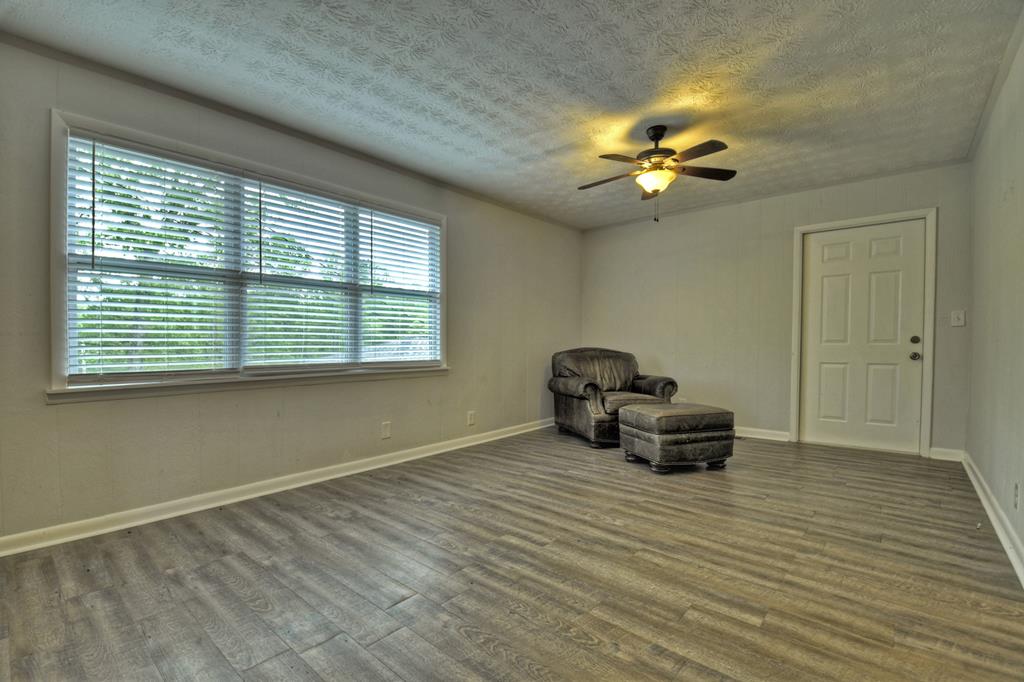 870-868 Sugar Creek Road Blue Ridge, GA 30513 - Photo 18 of 84 a view of livingroom with furniture chandelier fan and a window