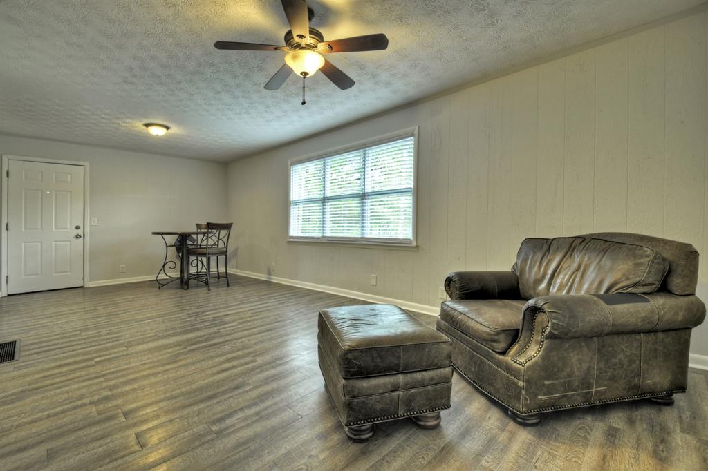 870-868 Sugar Creek Road Blue Ridge, GA 30513 - Photo 20 of 84 a living room with furniture and a wooden floor