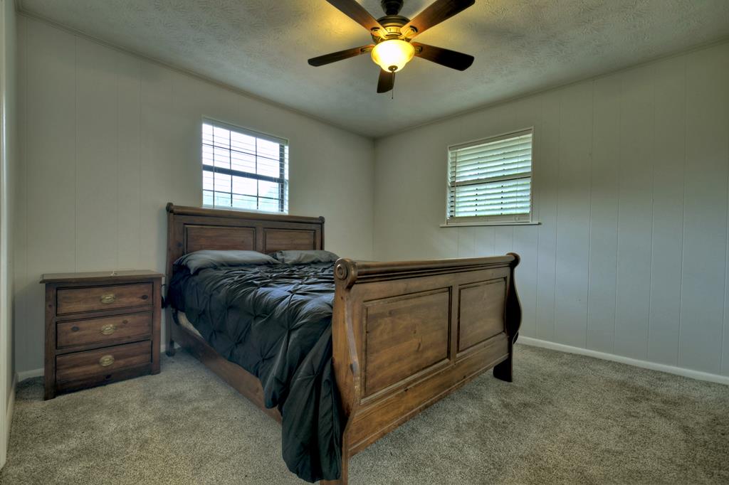 870-868 Sugar Creek Road Blue Ridge, GA 30513 - Photo 29 of 84 a bedroom with a bed and a window