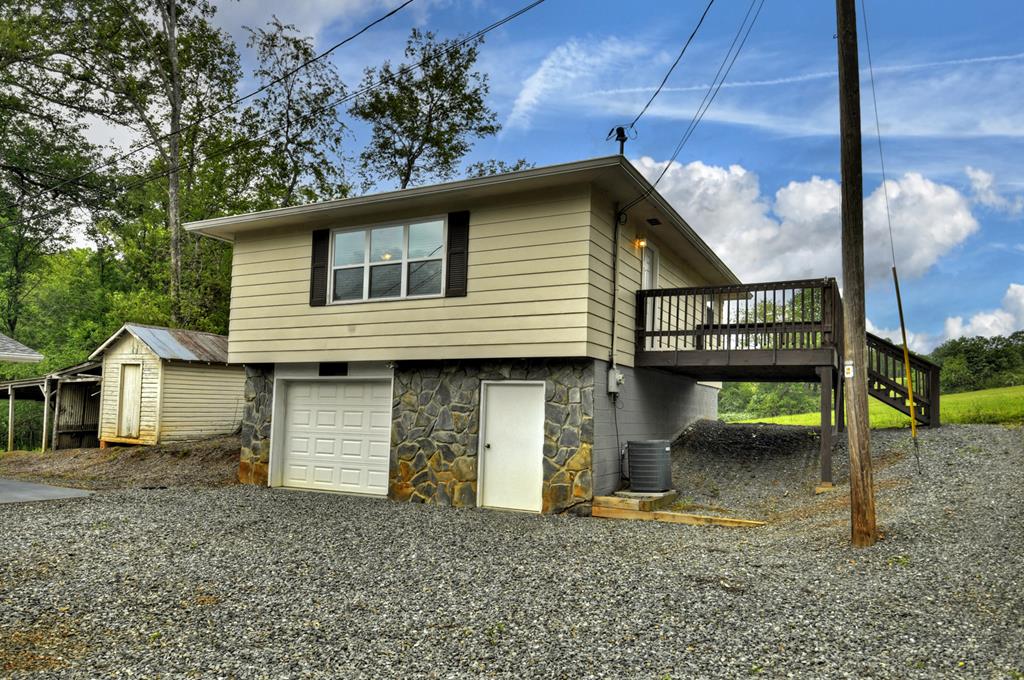 870-868 Sugar Creek Road Blue Ridge, GA 30513 - Photo 30 of 84 a view of a house with a patio