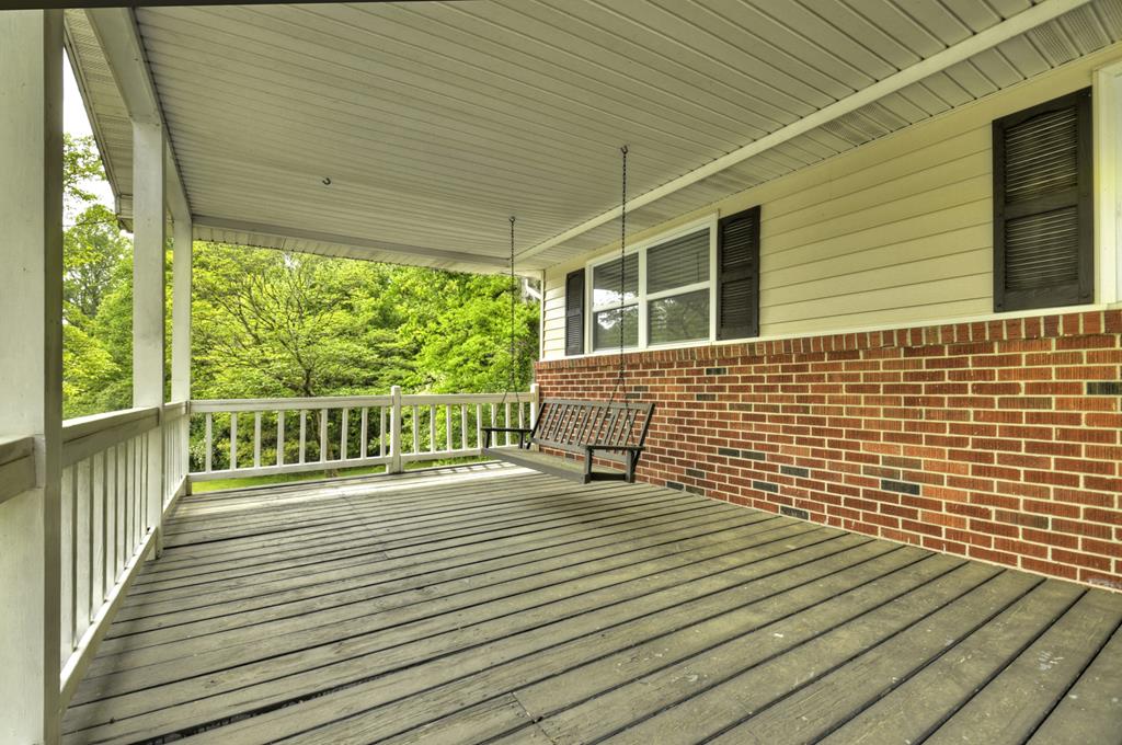 870-868 Sugar Creek Road Blue Ridge, GA 30513 - Photo 48 of 84 a view of a balcony with wooden floor