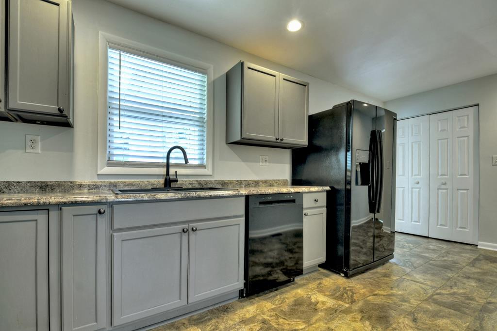 870-868 Sugar Creek Road Blue Ridge, GA 30513 - Photo 51 of 84 a kitchen with stainless steel appliances granite countertop a refrigerator and a sink