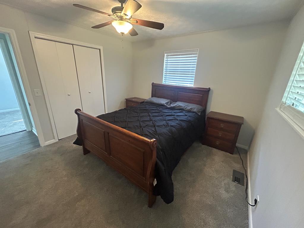 870-868 Sugar Creek Road Blue Ridge, GA 30513 - Photo 54 of 84 a bed sitting in a bedroom next to a window