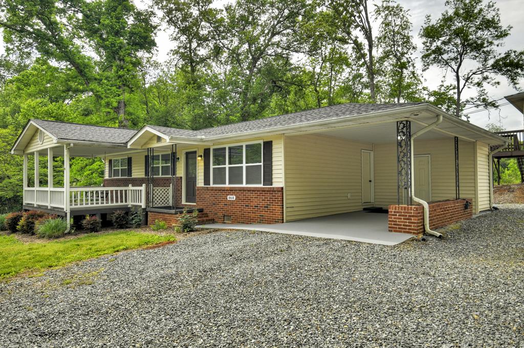 870-868 Sugar Creek Road Blue Ridge, GA 30513 - Photo 56 of 84 a view of a house with a yard and sitting area