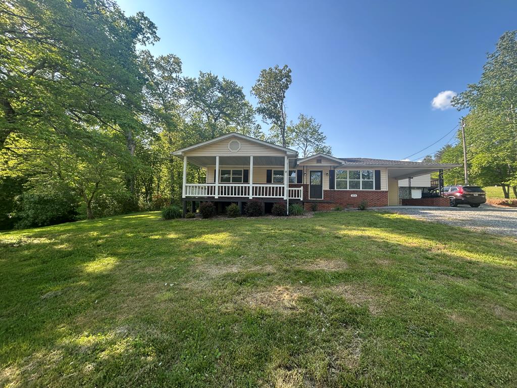 870-868 Sugar Creek Road Blue Ridge, GA 30513 - Photo 60 of 84 a front view of a house with a yard table and chairs