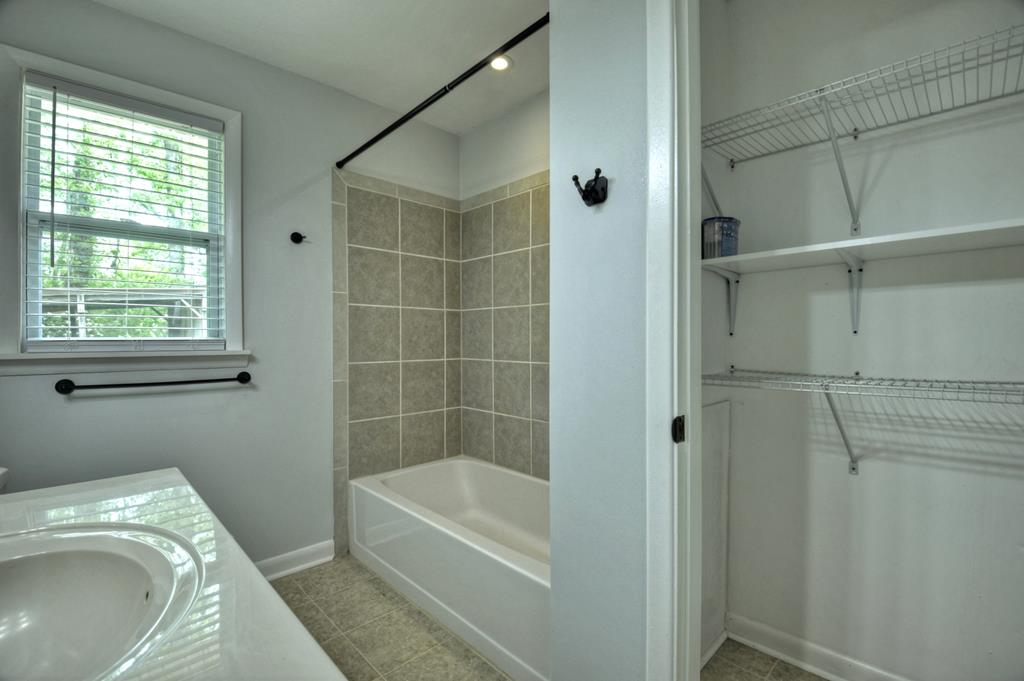 870-868 Sugar Creek Road Blue Ridge, GA 30513 - Photo 61 of 84 a bathroom with a sink a toilet and shower