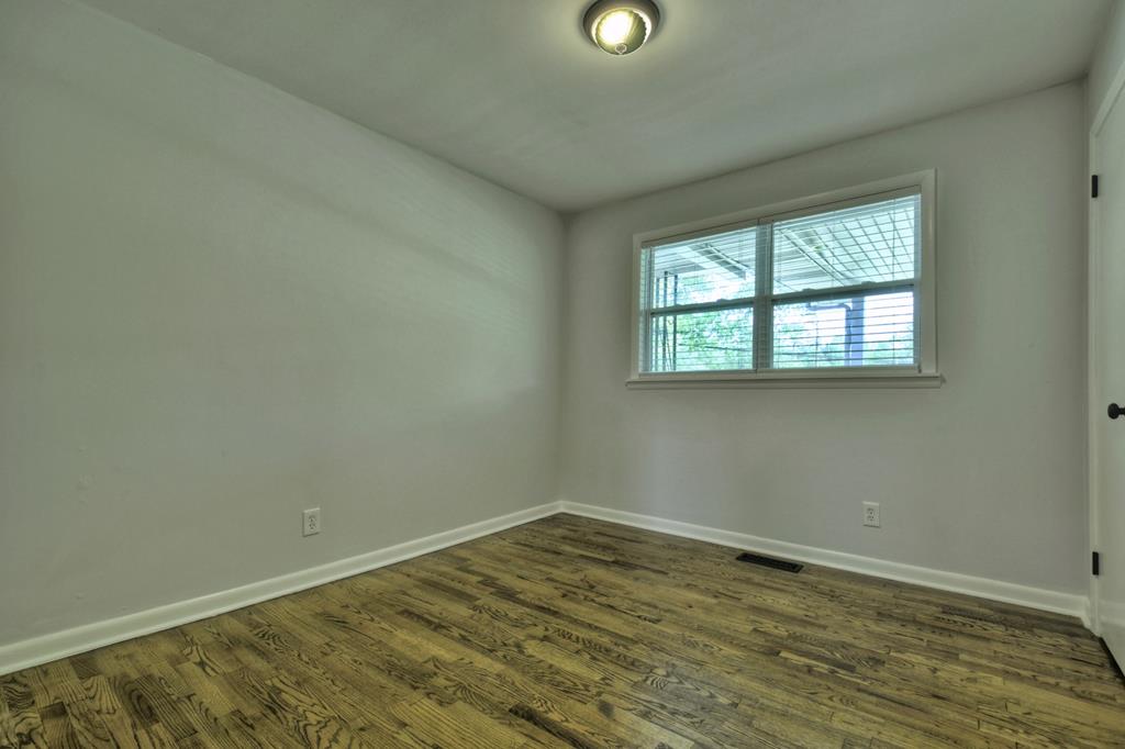 870-868 Sugar Creek Road Blue Ridge, GA 30513 - Photo 62 of 84 an empty room with wooden floor and windows