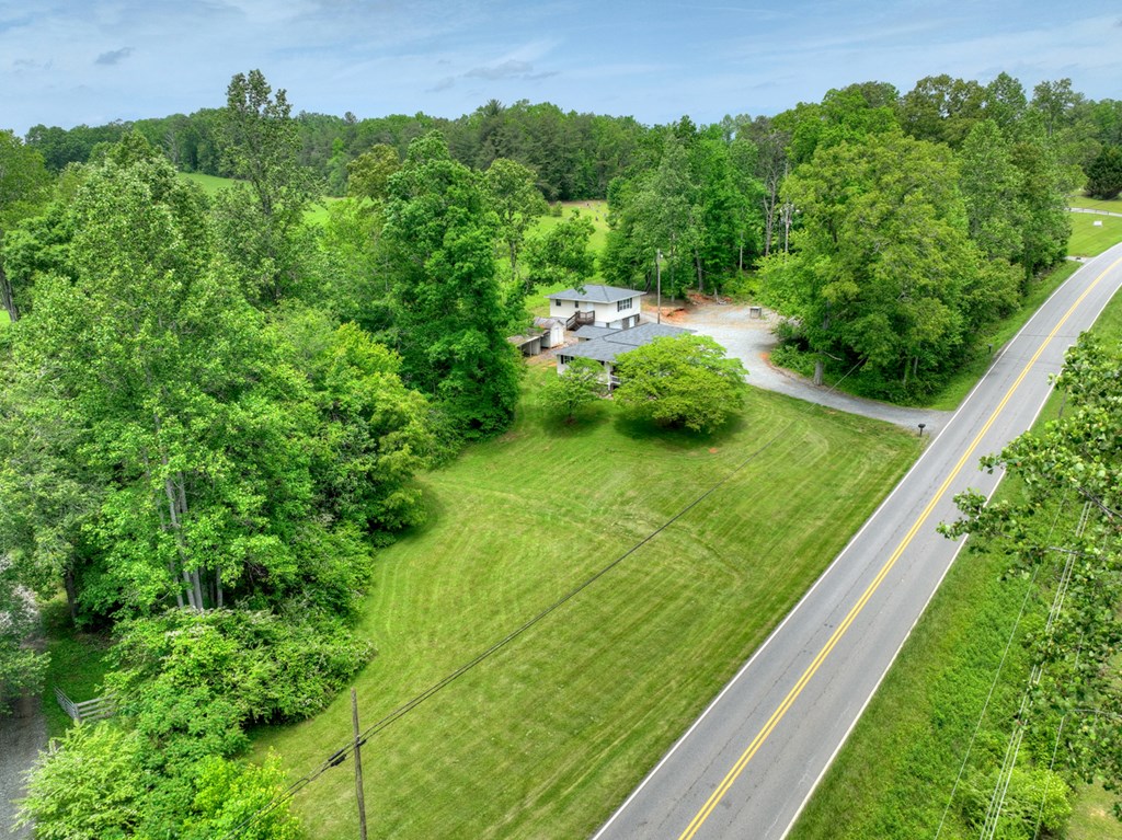 870-868 Sugar Creek Road Blue Ridge, GA 30513 - Photo 63 of 84 a view of a garden with a building in the background