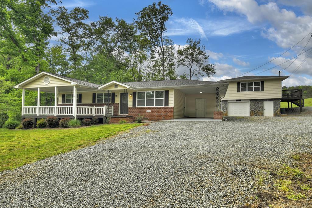 870-868 Sugar Creek Road Blue Ridge, GA 30513 - Photo 66 of 84 a view of a house with a yard and large trees