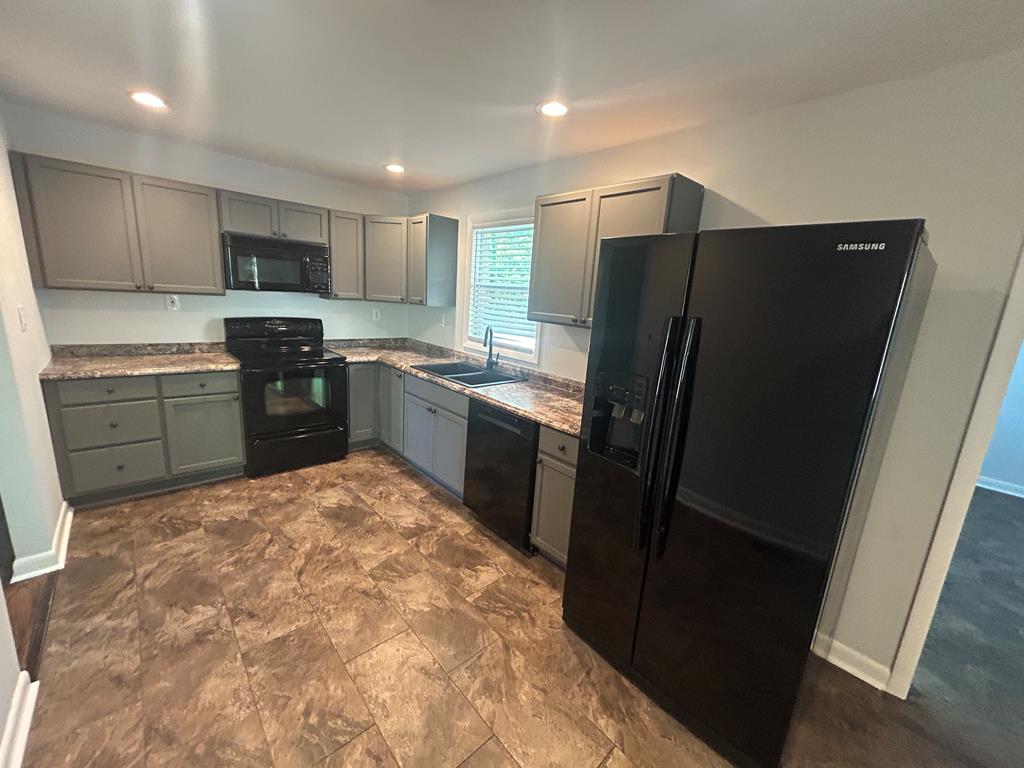870-868 Sugar Creek Road Blue Ridge, GA 30513 - Photo 73 of 84 a kitchen with stainless steel appliances granite countertop a refrigerator stove top oven a sink and dishwasher