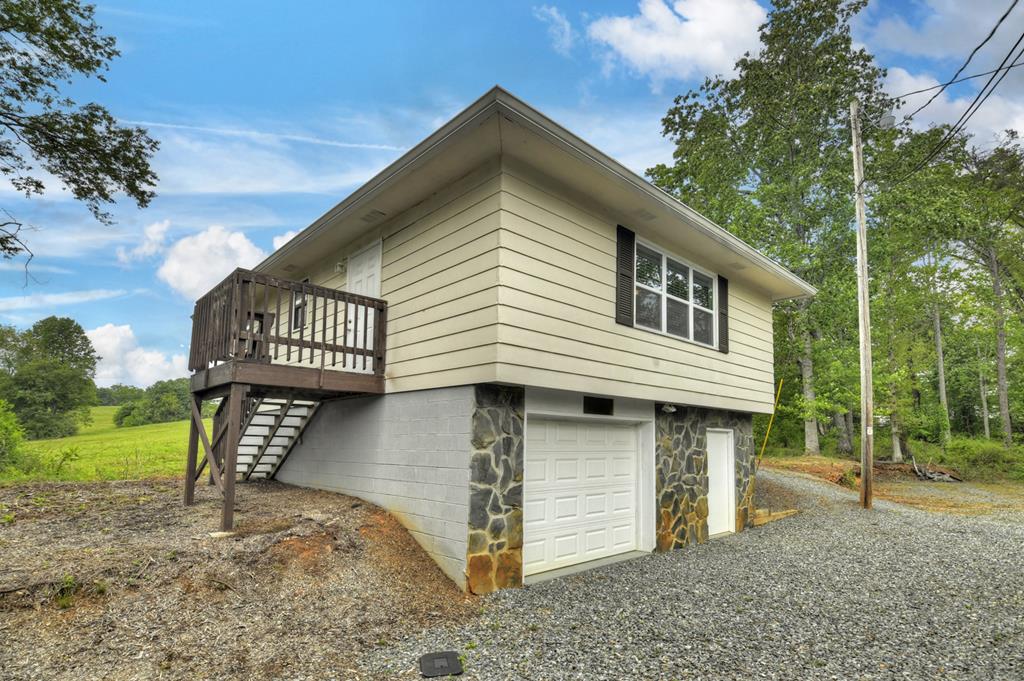 870-868 Sugar Creek Road Blue Ridge, GA 30513 - Photo 78 of 84 a front view of a house with garden