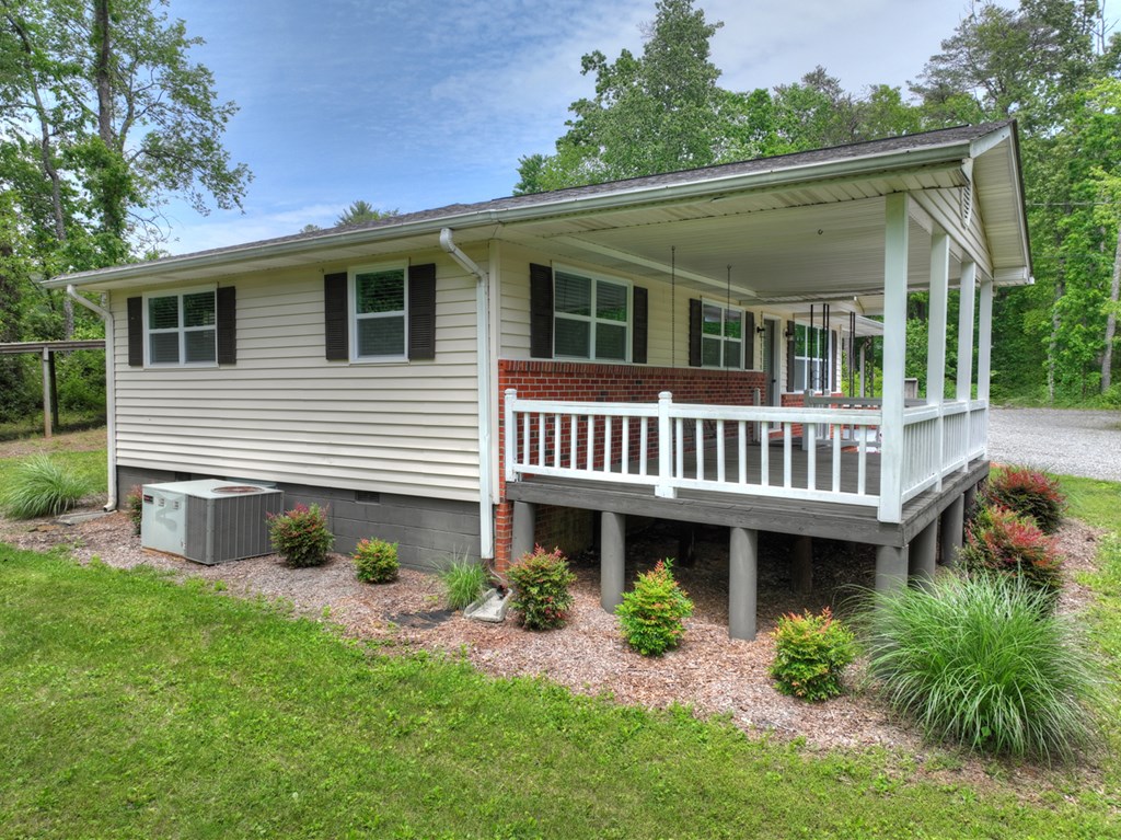 870-868 Sugar Creek Road Blue Ridge, GA 30513 - Photo 9 of 84 a front view of a house with garden