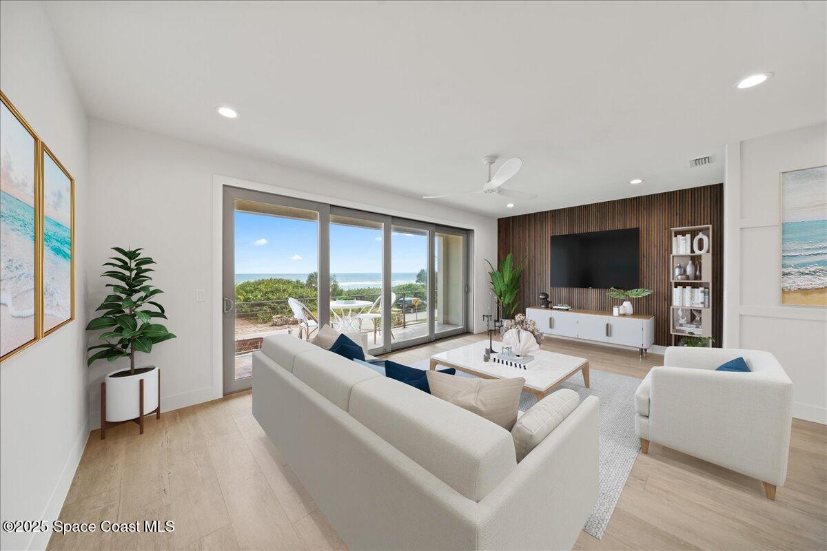 1004 Wave Crest Avenue Indialantic, FL 32903 - Photo 12 of 51 a living room with furniture and a large window
