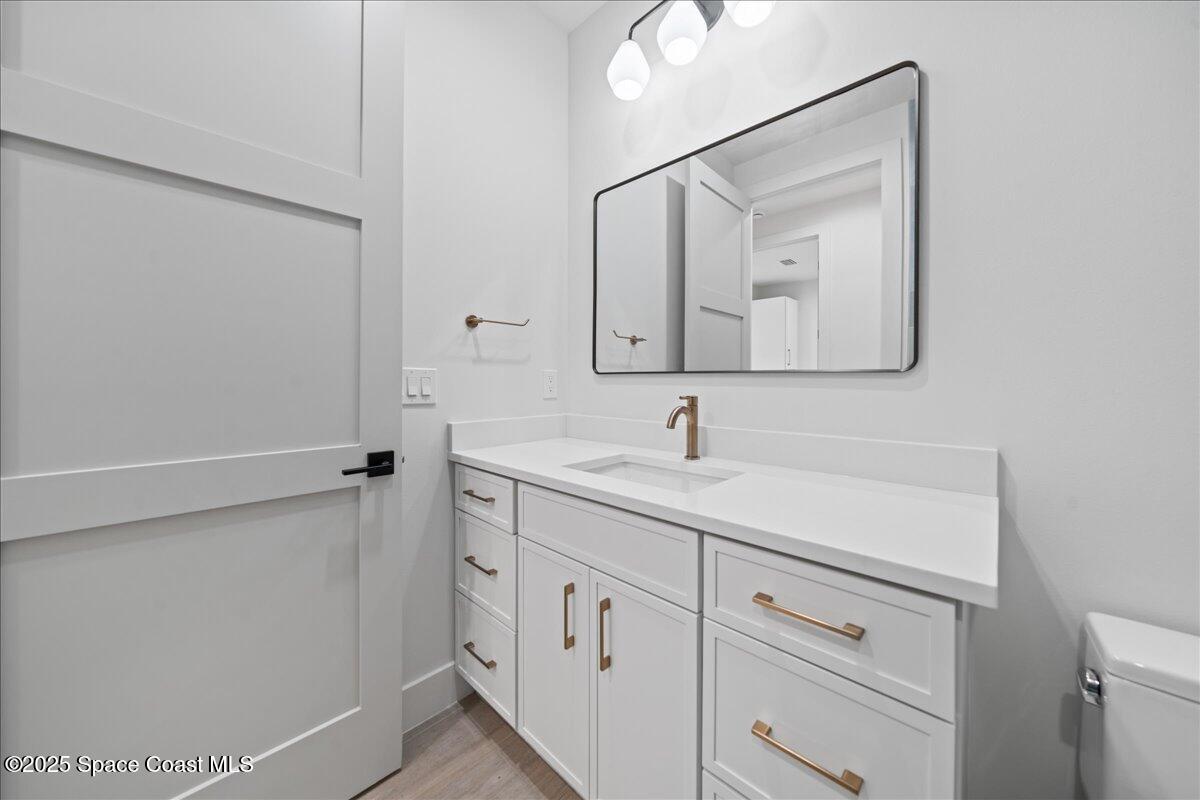 1004 Wave Crest Avenue Indialantic, FL 32903 - Photo 17 of 51 a bathroom with a sink and a mirror