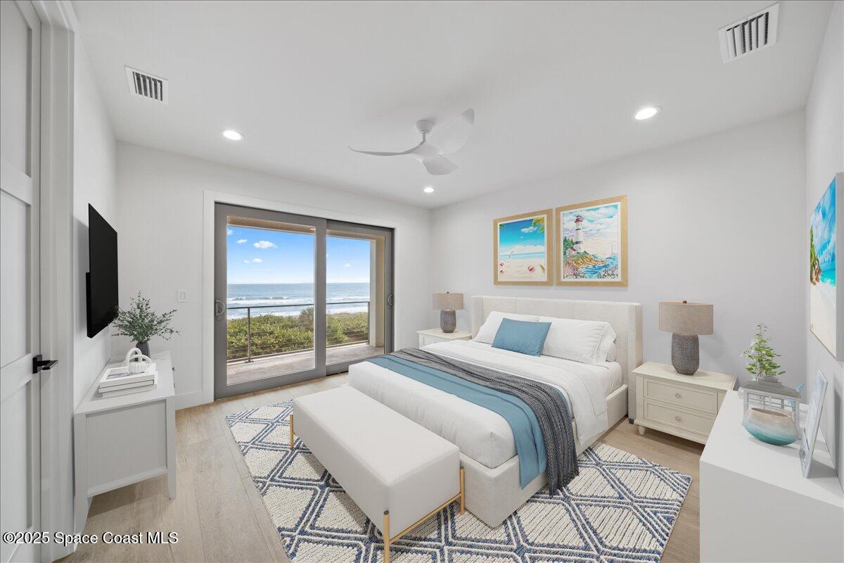 1004 Wave Crest Avenue Indialantic, FL 32903 - Photo 26 of 51 a bedroom with a large bed and a flat screen tv