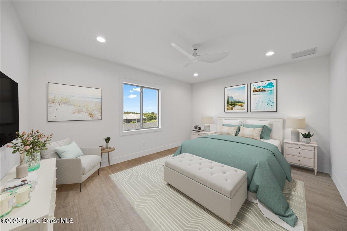 1004 Wave Crest Avenue Indialantic, FL 32903 - Photo 32 of 51 a bedroom with a large bed couch and a window