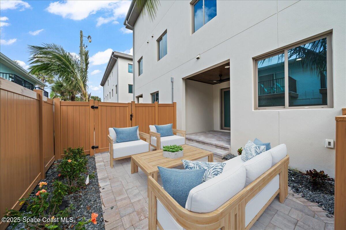 1004 Wave Crest Avenue Indialantic, FL 32903 - Photo 40 of 51 a outdoor living room with furniture and a potted plant