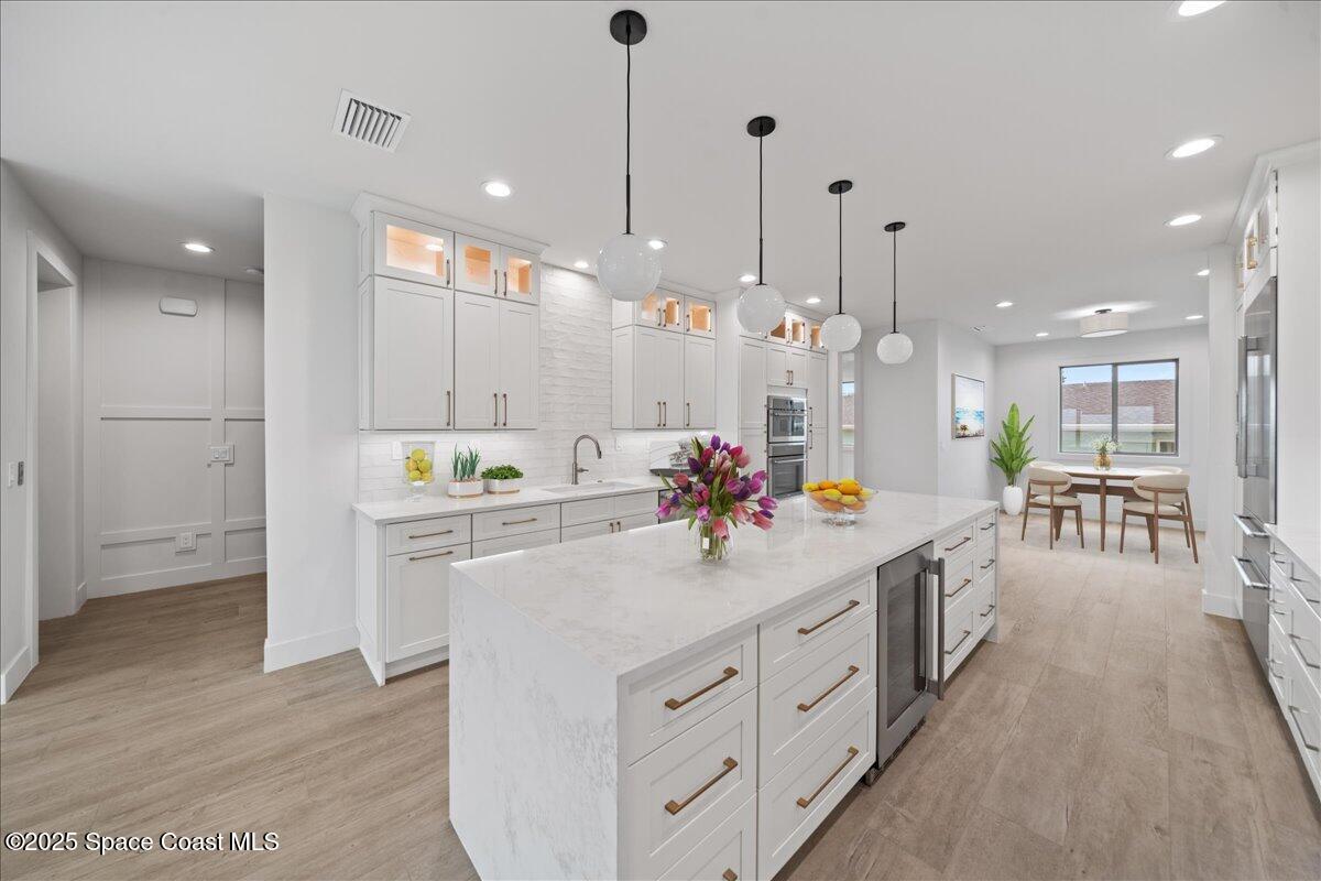 1004 Wave Crest Avenue Indialantic, FL 32903 - Photo 6 of 51 a kitchen with kitchen island a sink appliances and a counter top space