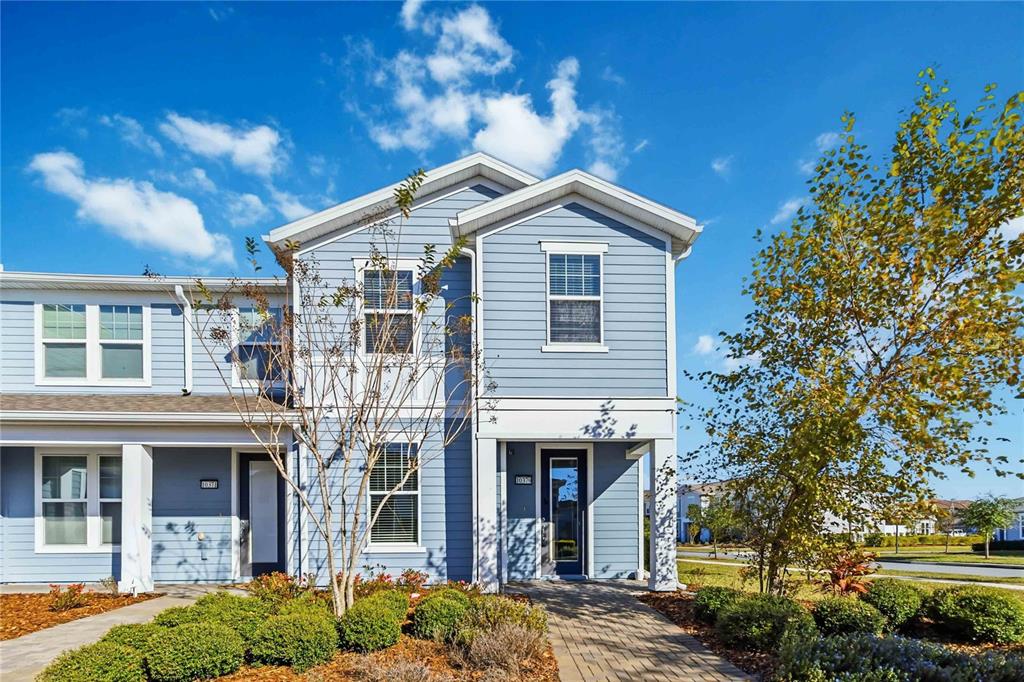 10379 Folly Beach Road Orlando, FL 32827 - Photo 1 of 56 a front view of a house with a yard