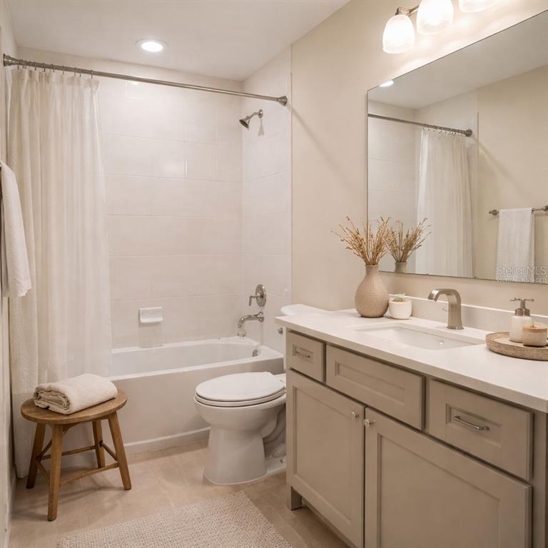 10379 Folly Beach Road Orlando, FL 32827 - Photo 13 of 56 a bathroom with a toilet sink and mirror