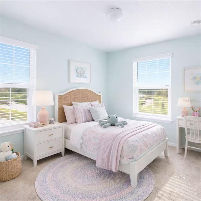 10379 Folly Beach Road Orlando, FL 32827 - Photo 13 of 54 a bedroom with a bed and a window