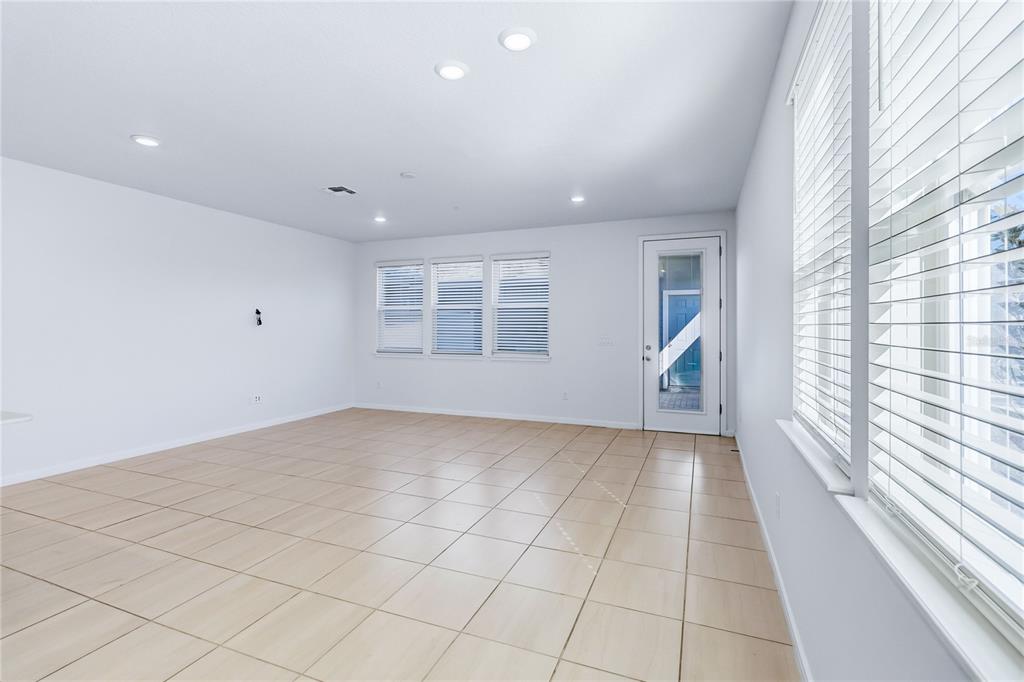 10379 Folly Beach Road Orlando, FL 32827 - Photo 16 of 56 a view of an empty room and a window