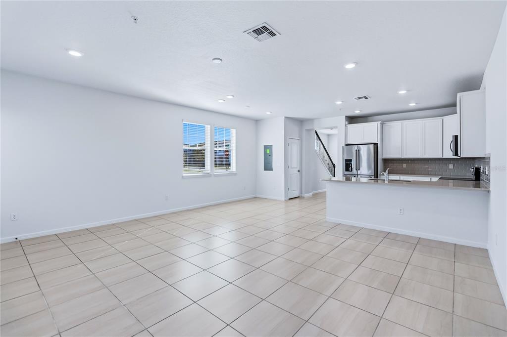 10379 Folly Beach Road Orlando, FL 32827 - Photo 20 of 54 a view of kitchen with granite countertop cabinets and sink