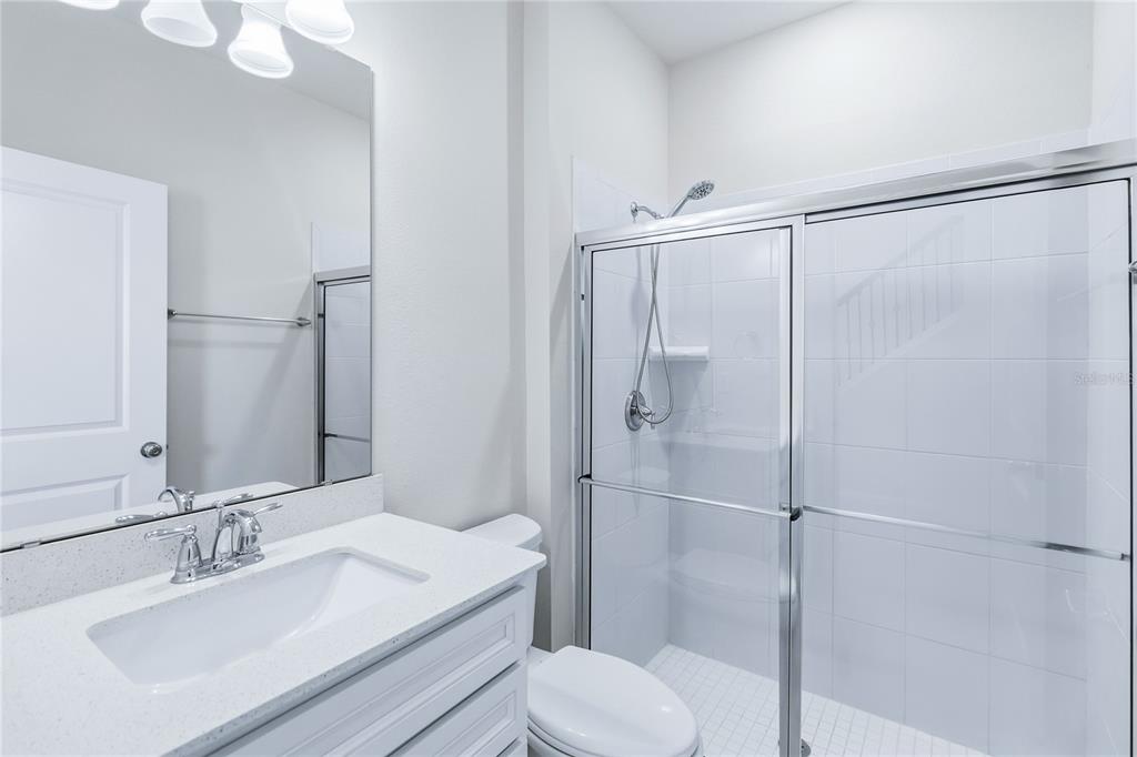 10379 Folly Beach Road Orlando, FL 32827 - Photo 25 of 54 a bathroom with a sink toilet and shower