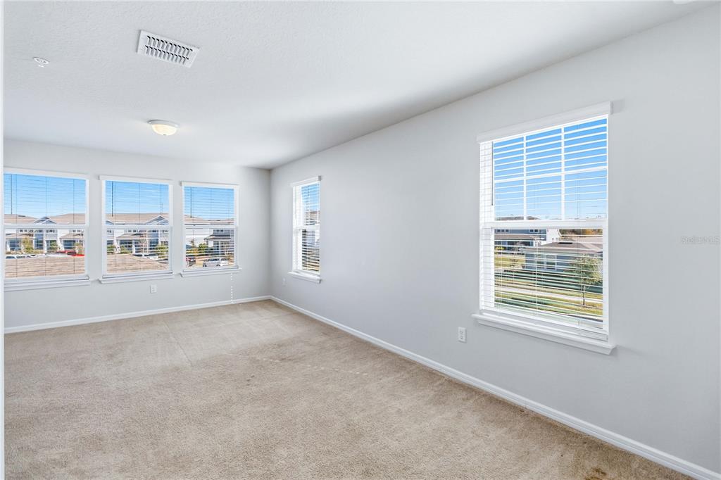 10379 Folly Beach Road Orlando, FL 32827 - Photo 27 of 56 a view of an empty room with a window