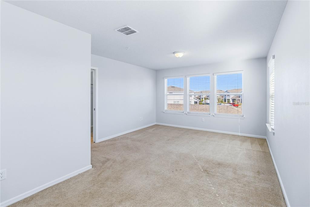 10379 Folly Beach Road Orlando, FL 32827 - Photo 28 of 56 an empty room with windows