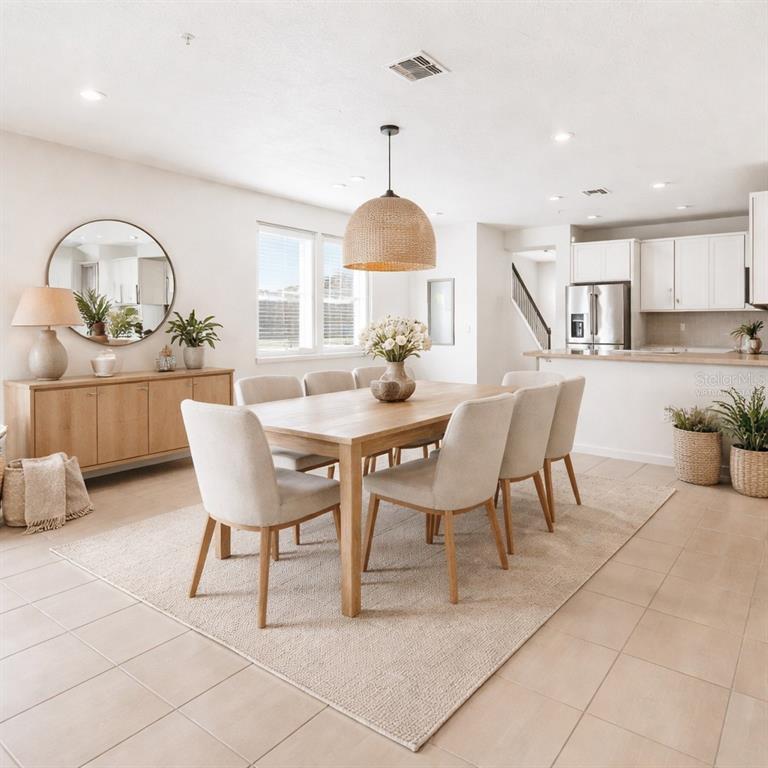 10379 Folly Beach Road Orlando, FL 32827 - Photo 3 of 56 a dining room with furniture and window