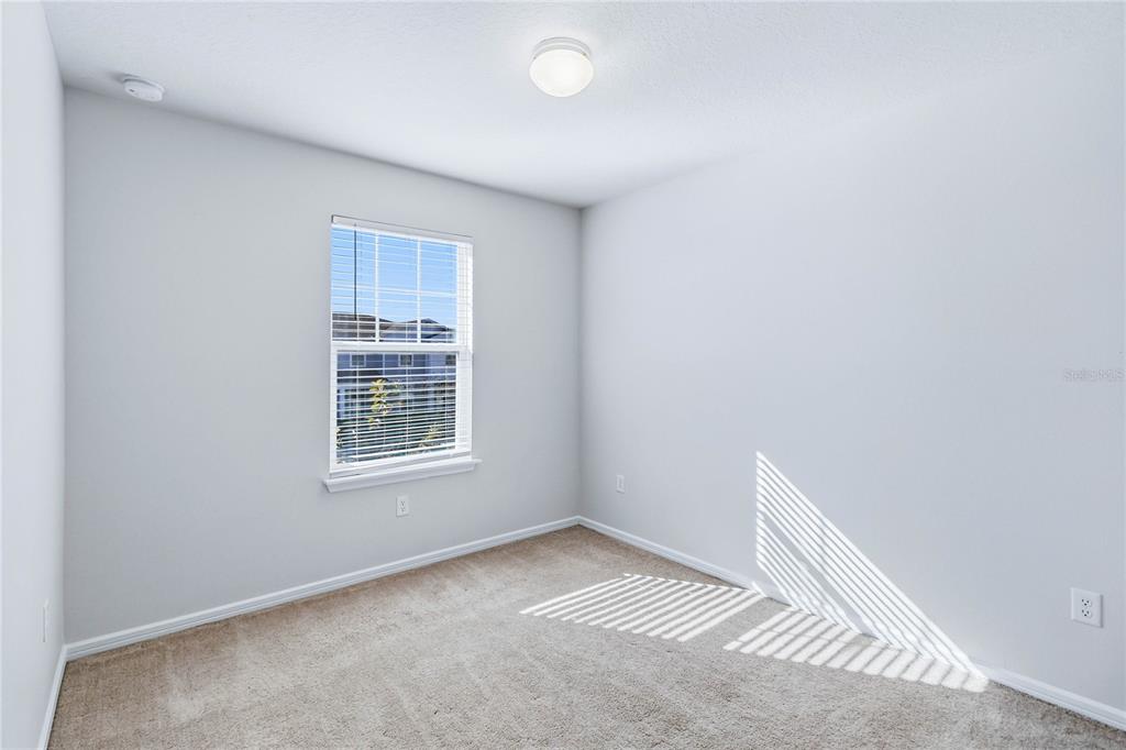 10379 Folly Beach Road Orlando, FL 32827 - Photo 37 of 54 a view of an empty room with a window
