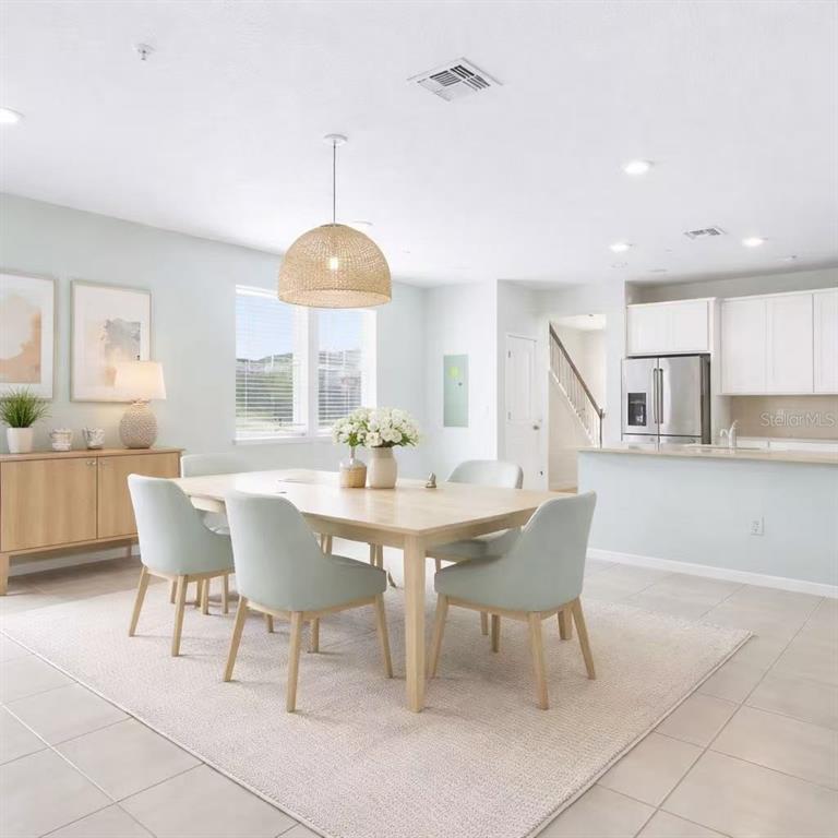 10379 Folly Beach Road Orlando, FL 32827 - Photo 4 of 54 a dining room with furniture and window