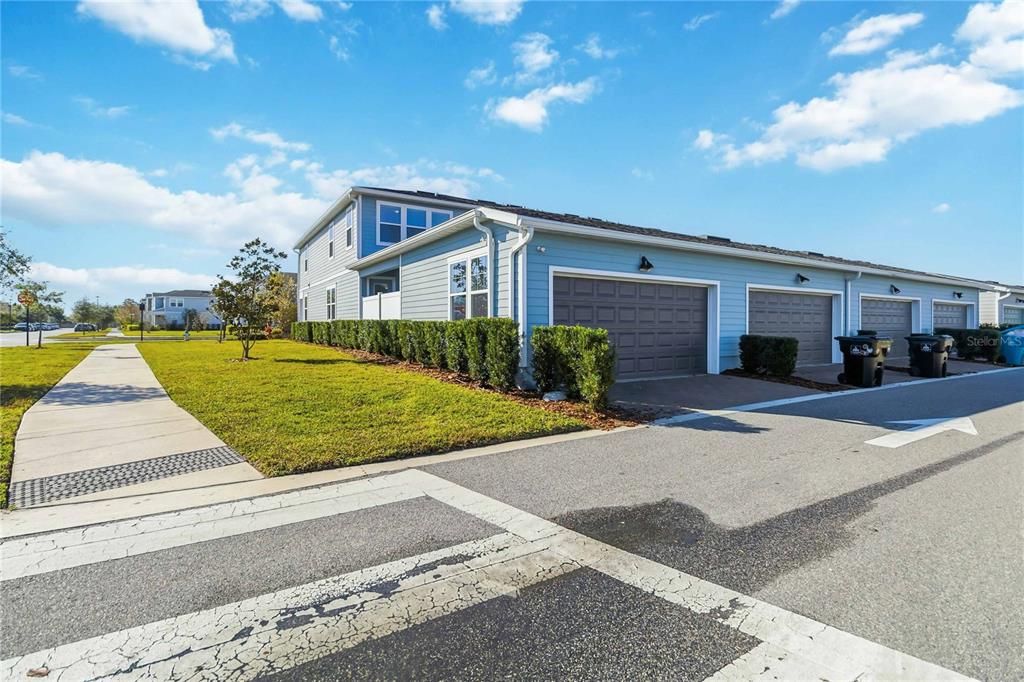 10379 Folly Beach Road Orlando, FL 32827 - Photo 46 of 54 a front view of a house with a yard