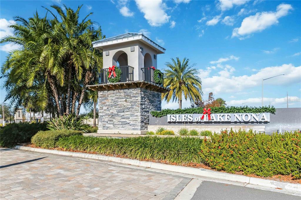 10379 Folly Beach Road Orlando, FL 32827 - Photo 49 of 56 a front view of a house with garden