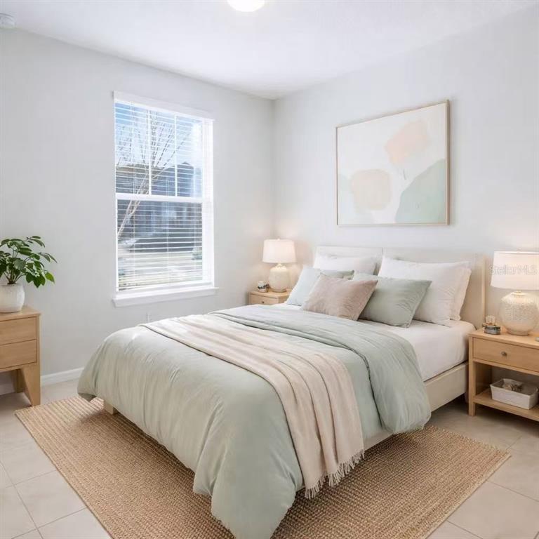 10379 Folly Beach Road Orlando, FL 32827 - Photo 6 of 54 a bedroom with bed and a window