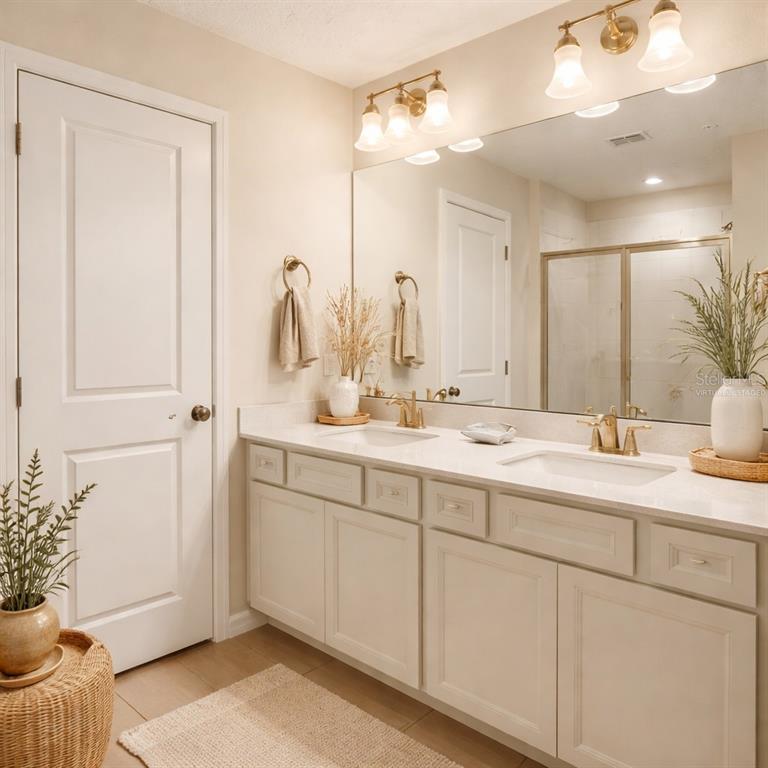10379 Folly Beach Road Orlando, FL 32827 - Photo 8 of 56 a bathroom with a sink and a mirror