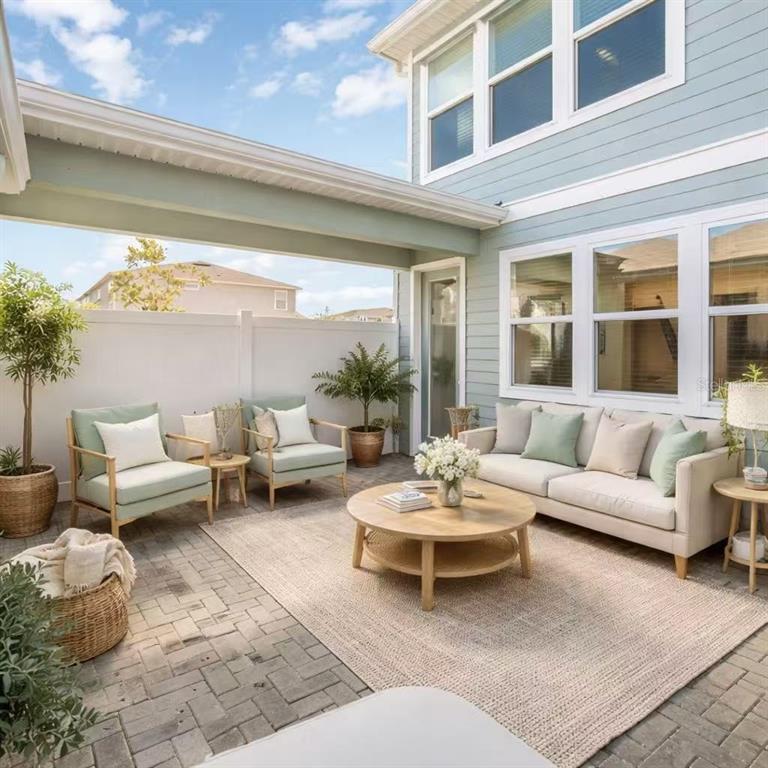 10379 Folly Beach Road Orlando, FL 32827 - Photo 8 of 54 a living room with furniture and a large window