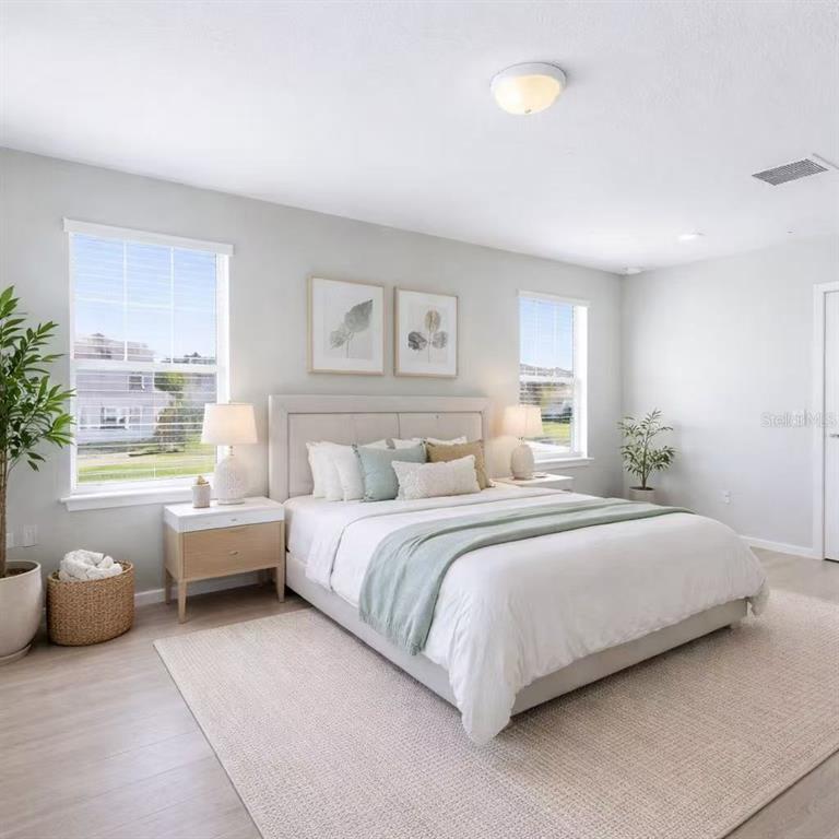 10379 Folly Beach Road Orlando, FL 32827 - Photo 9 of 54 a bed room with a bed and a couch