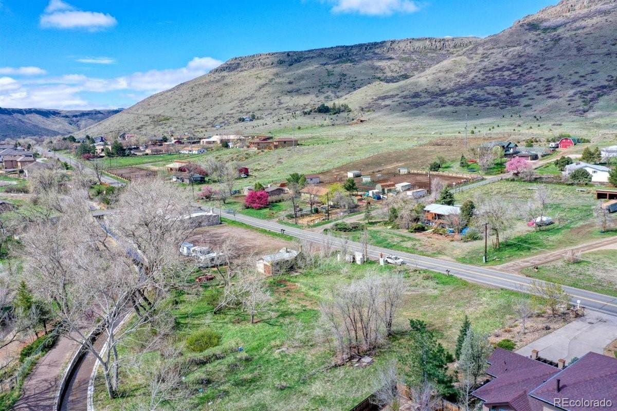 5070 Easley Road Golden, CO 80403 - Photo 4 of 24 a view of a lake with a mountain in the back