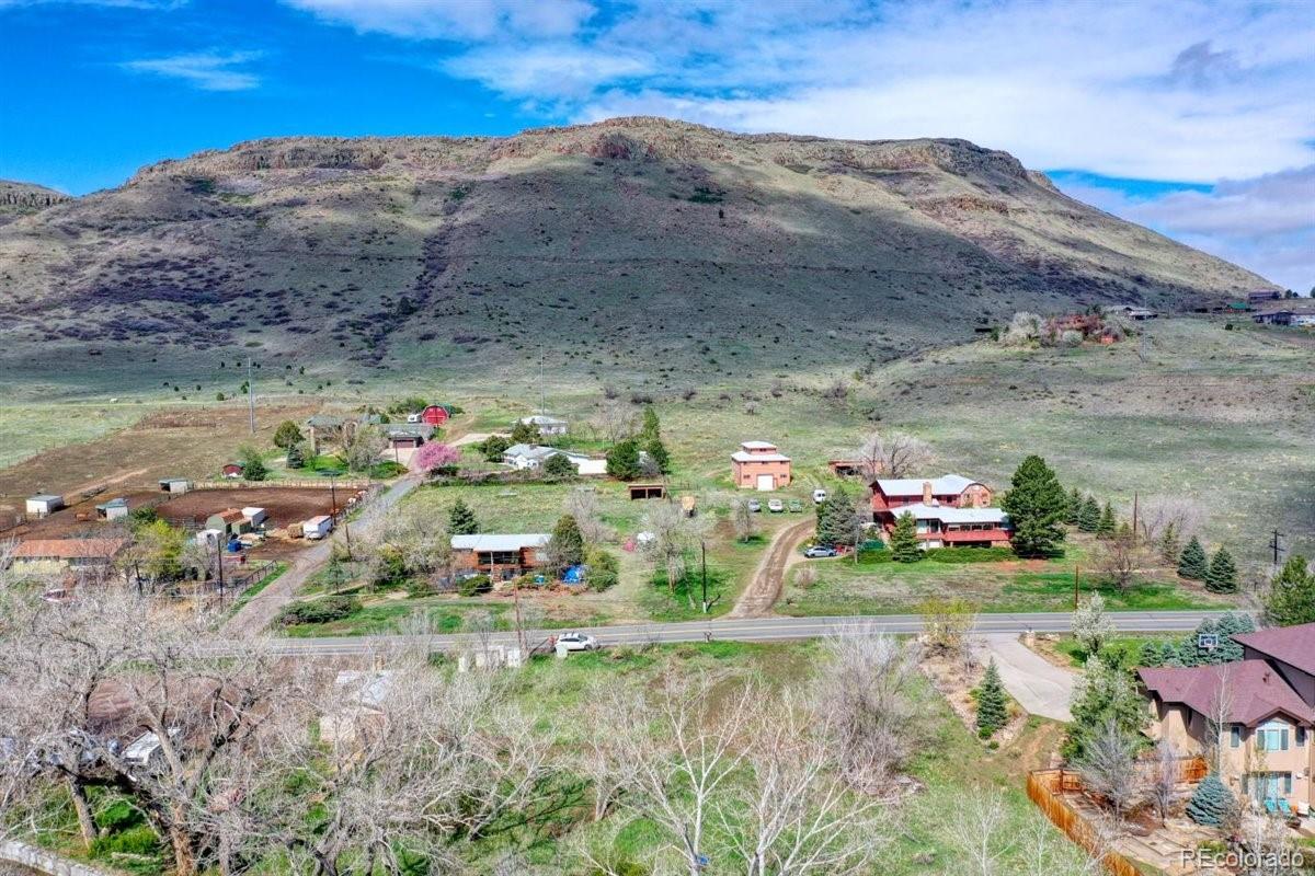 5070 Easley Road Golden, CO 80403 - Photo 5 of 24 a view of backyard with a table and chairs