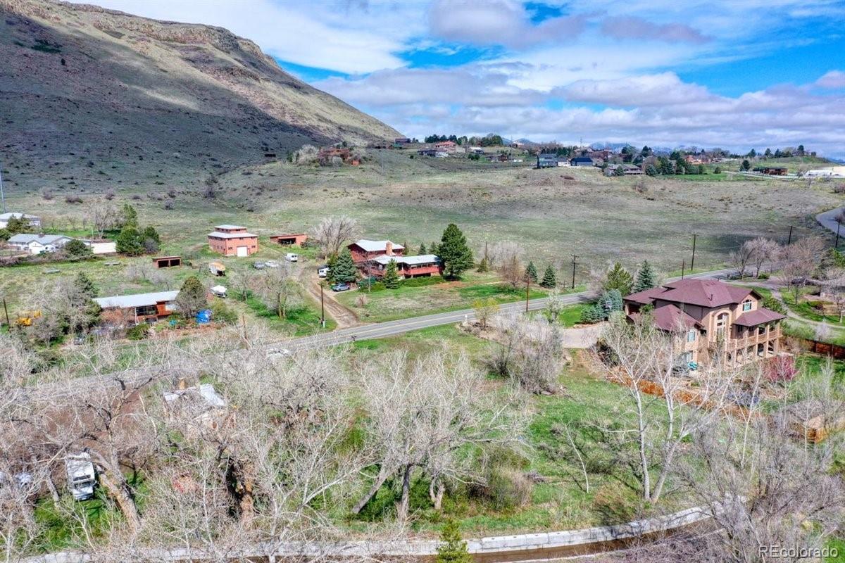5070 Easley Road Golden, CO 80403 - Photo 8 of 24 a view of a lake with a mountain