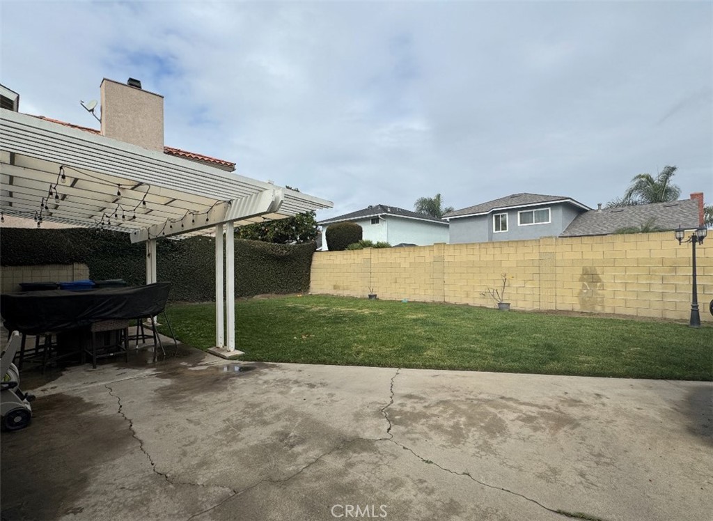 6939 Tahiti Drive Cypress, CA 90630 - Photo 13 of 15 a view of a house with a yard and sitting area